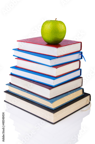 Photo: Back to school concept with books and apple Back to school concept with books and apple