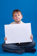 boy holding a blank