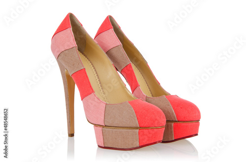 Photo: Elegant woman shoes isolated on white Elegant woman shoes isolated on white