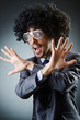 Man with afro haircut singing in studio