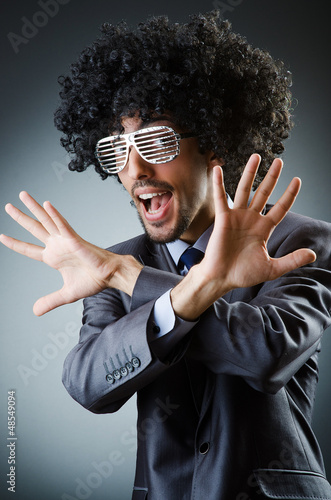 Photo: Man with afro haircut singing in studio Man with afro haircut singing in studio