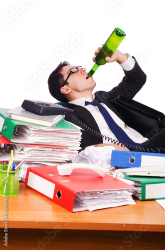 Photo: Young busy businessman at his desk Young busy businessman at his desk