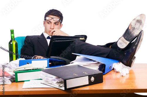 Photo: Young busy businessman at his desk Young busy businessman at his desk