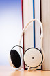 Concept of audio books with earphones on white