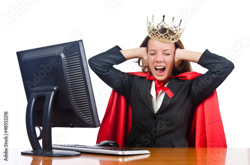 Photo: Superwoman worker with crown working in office Superwoman worker with crown working in office