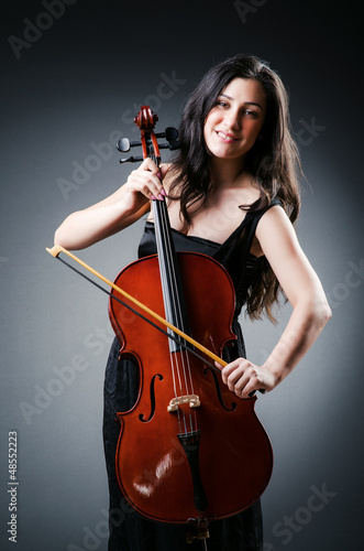 Photo: Woman cellist performing with cello Woman cellist performing with cello