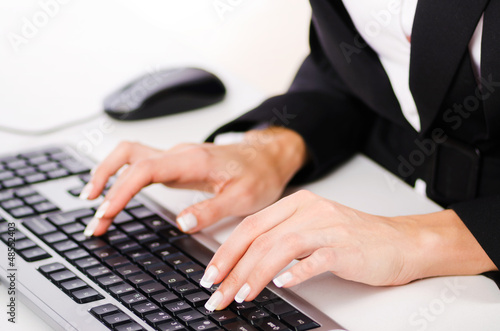 Photo: Hands working on the keyboard Hands working on the keyboard