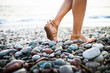 Photo: Young woman on the beach enjoying a warm summer evening Young woman on the beach enjoying a warm summer evening