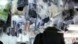 Many clothes hang and move in dry cleaning
