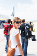 Departure - young woman at an airport about to board an aircraft
