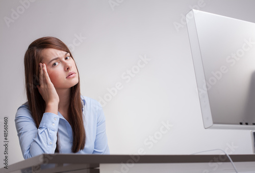 Photo: Beautiful woman tired at work Beautiful woman tired at work