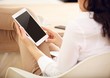 Photo: Young Businesswoman with a Handheld Digital Tablet Young Businesswoman with a Handheld Digital Tablet