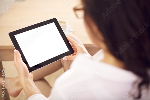 Photo: Woman Holding A Digital Tablet in Her Hands Woman Holding A Digital Tablet in Her Hands