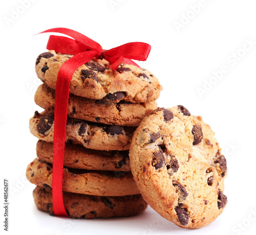 Photo: Chocolate chips cookies with red ribbon isolated on white. Chocolate chips cookies with red ribbon isolated on white.