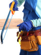 Male builder in blue overalls sawing board isolated on white
