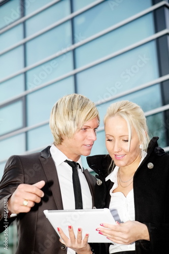 Photo: business woman man digital tablet business woman man digital tablet