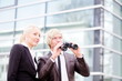business people pointing binoculars