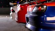 Three cars with colorful sport design at night