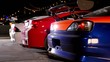 Exhaust smoke goes from tubes of few cars with sport design