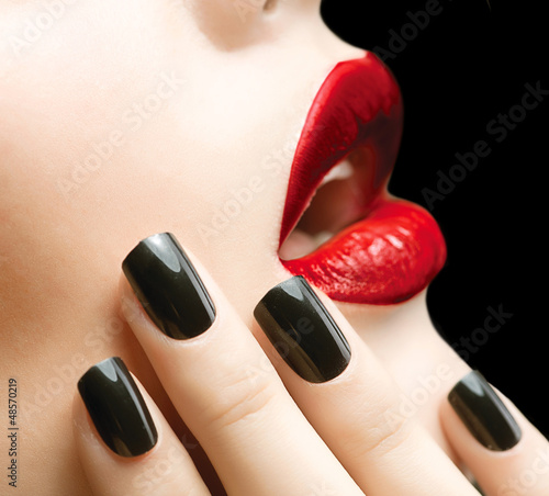 Photo: Makeup and Manicure. Black Nails and Red Lips Makeup and Manicure. Black Nails and Red Lips