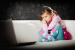Photo: Girl looking at laptop screen Girl looking at laptop screen