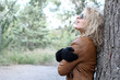 Blonde woman at the woods, laughing