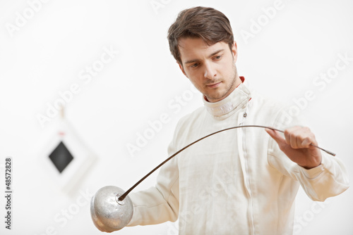 Photo: fencer checking rapier foil fencer checking rapier foil