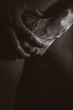 Male hands covering crotch