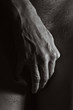 Male hands covering crotch