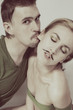 man and a woman with fake mustache on white background