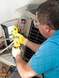 Male hispanic air-conditioning maintenance technician