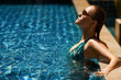Portrait of young attractive woman having good time in swimming