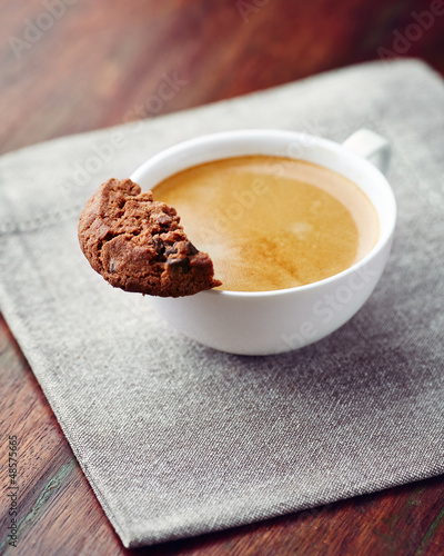 Photo: Cup of cafe crema with chocolate chip cookie Cup of cafe crema with chocolate chip cookie