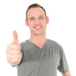 Handsome young man giving a thumbs up