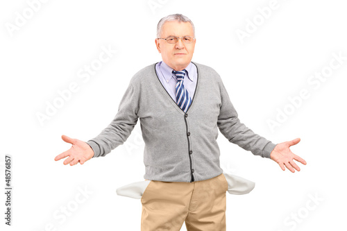 Photo: Poor man showing his empty pockets Poor man showing his empty pockets