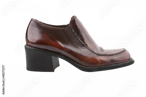Photo: Brown shiny women shoe isolated on white Brown shiny women shoe isolated on white