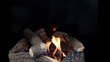 Tongues of flame go through slot in plate with stones