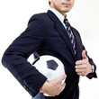 Football manager hold ball with his hands