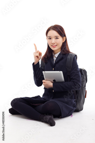 Photo: Yong pretty Asian student studying with tablet PC Yong pretty Asian student studying with tablet PC