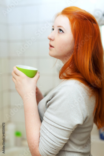 Photo: Teen girl gargling throat Teen girl gargling throat