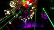 Several lasers hang under ceiling and emit green rays