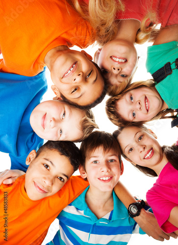 Photo: Circle of kids looking down Circle of kids looking down