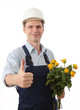 Contractor with flowers giving thumbs up sign