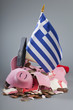 Robbed piggy bank Greek flag, hammer