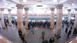 People wait and leave by train in subway at station