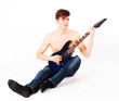 Photo: young fit male with electric guitar young fit male with electric guitar
