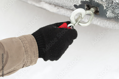 Photo: Man with towing rope near car Man with towing rope near car