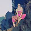 Glamorous beauty on rocky shore