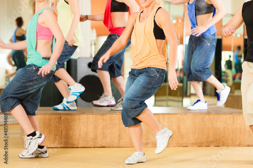 Photo: Zumba or Jazzdance - young people dancing in studio Zumba or Jazzdance - young people dancing in studio
