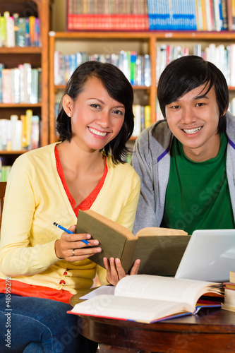 Photo: Students in library are a learning group Students in library are a learning group